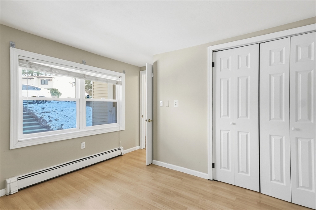 6 Adams Court, Unit 6 Amesbury, MA 01913 - Photo 11 of 22 an empty room with windows