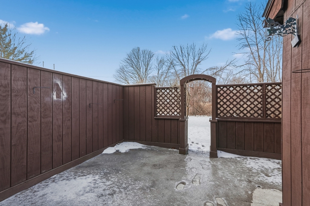 6 Adams Court, Unit 6 Amesbury, MA 01913 - Photo 20 of 22 a backyard of a house