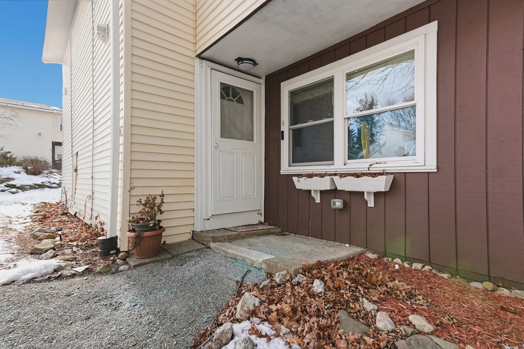 6 Adams Court, Unit 6 Amesbury, MA 01913 - Photo 2 of 22 a front view of a house