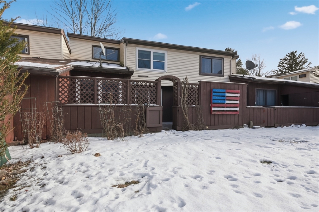 6 Adams Court, Unit 6 Amesbury, MA 01913 - Photo 22 of 22 a front view of a house with a yard