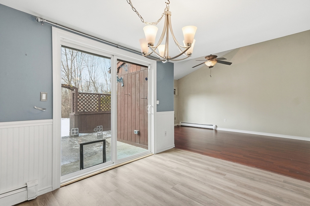 6 Adams Court, Unit 6 Amesbury, MA 01913 - Photo 5 of 22 a view of a room with wooden floor and bathroom