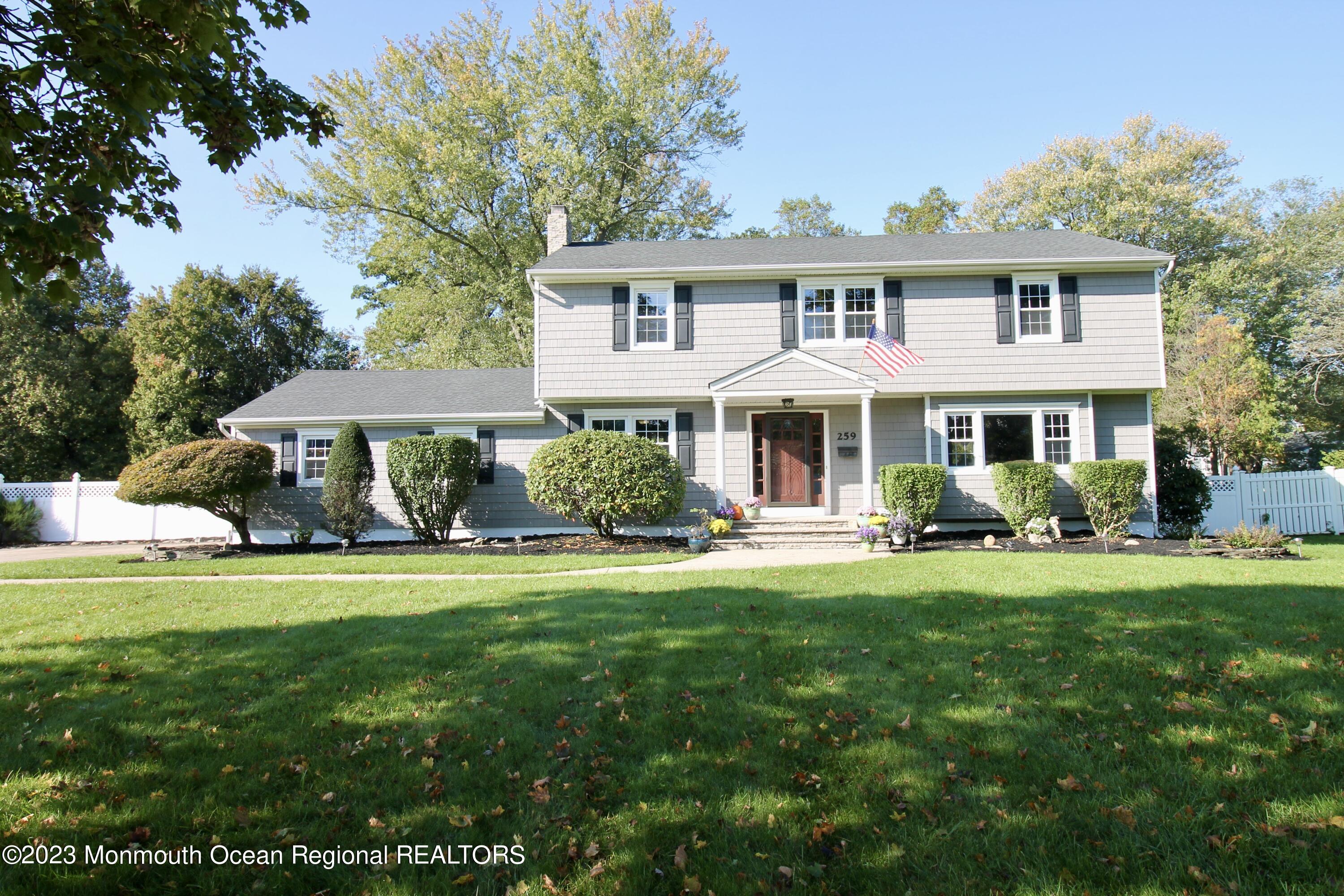 259 Kings Mountain Road Freehold, NJ 07728 - Photo 1 of 61 a front view of a house with a yard table and chairs