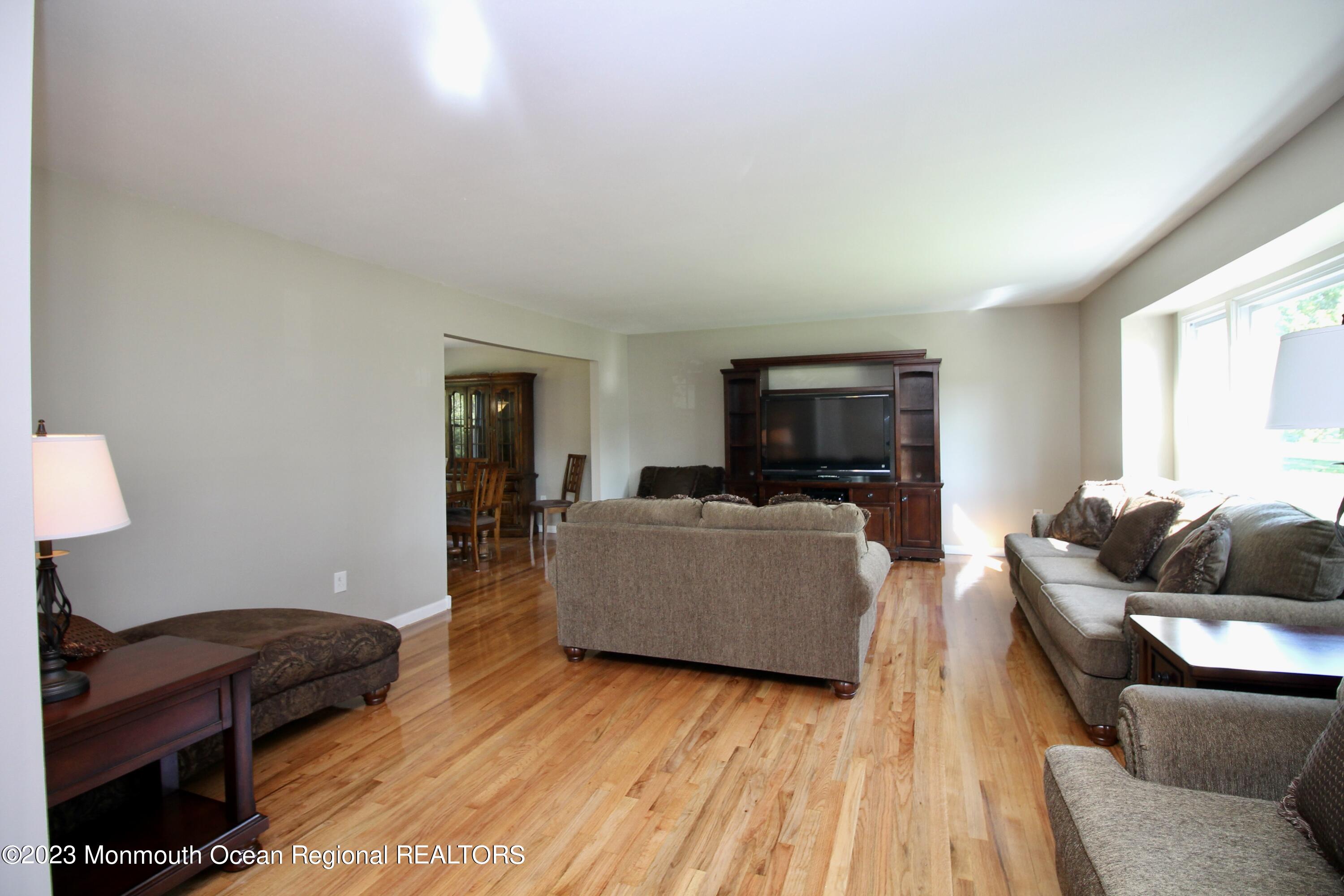 259 Kings Mountain Road Freehold, NJ 07728 - Photo 11 of 61 a living room with furniture and a flat screen tv