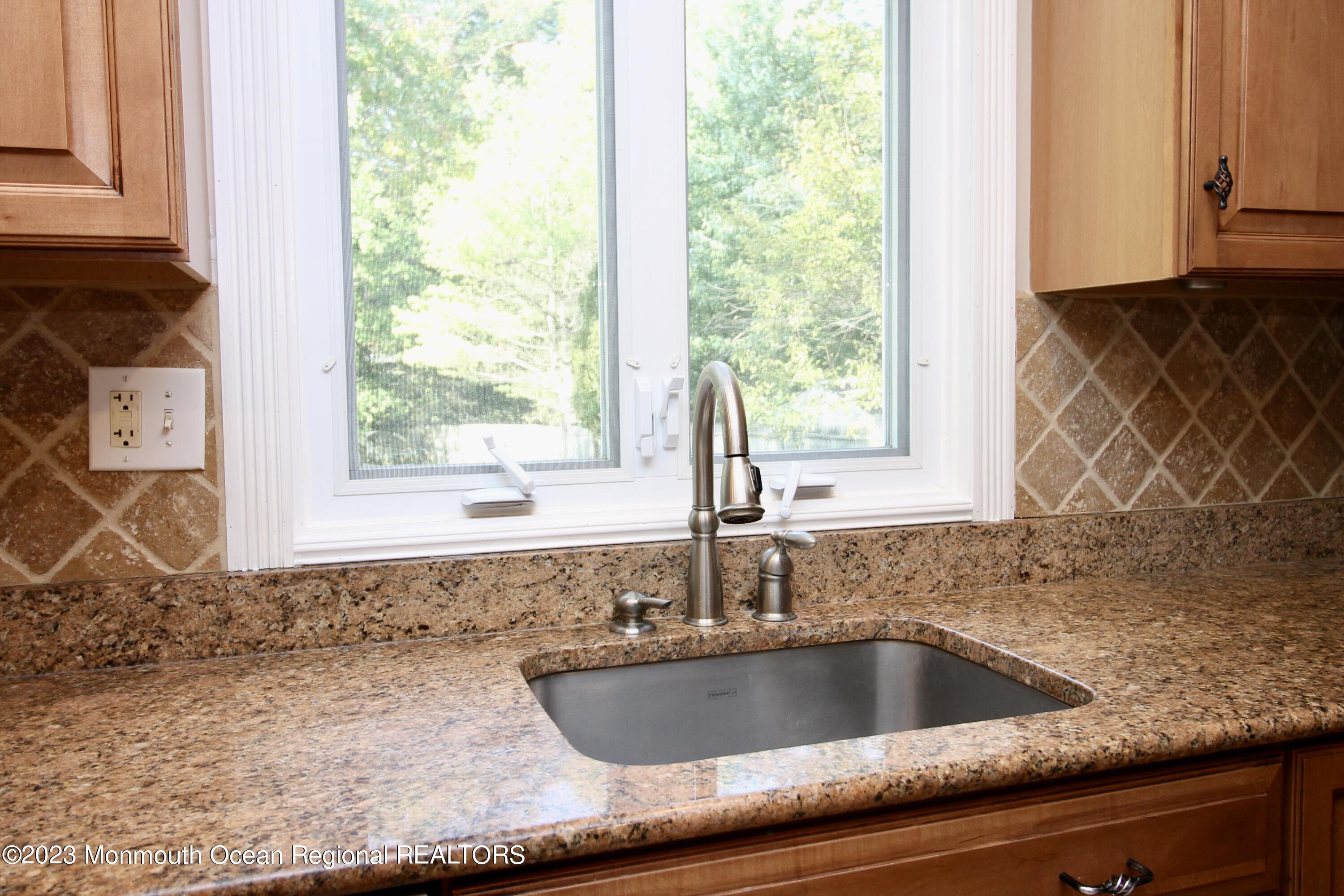 259 Kings Mountain Road Freehold, NJ 07728 - Photo 19 of 61 a kitchen with a sink and a window