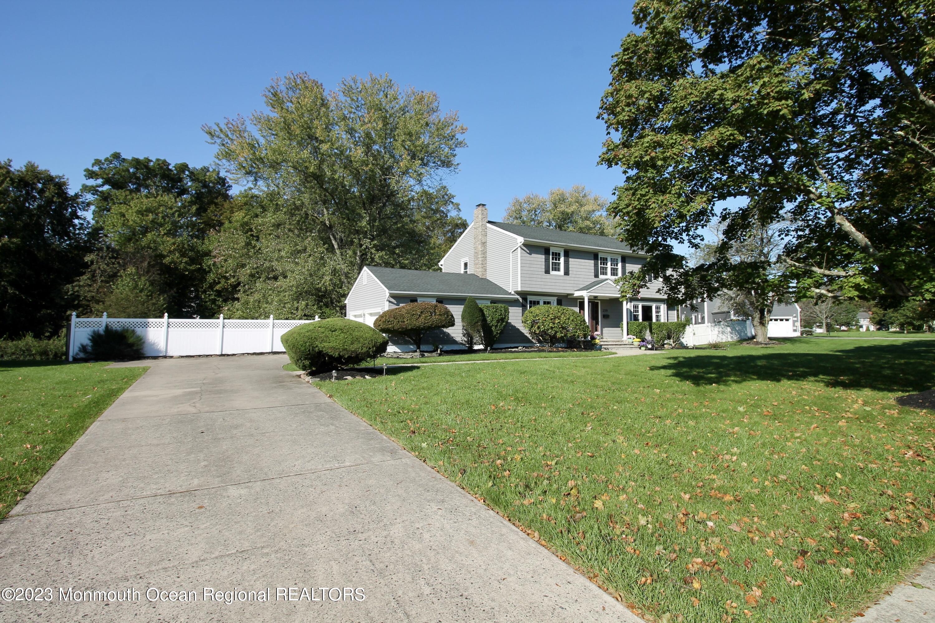 259 Kings Mountain Road Freehold, NJ 07728 - Photo 2 of 61 a front view of a house with garden