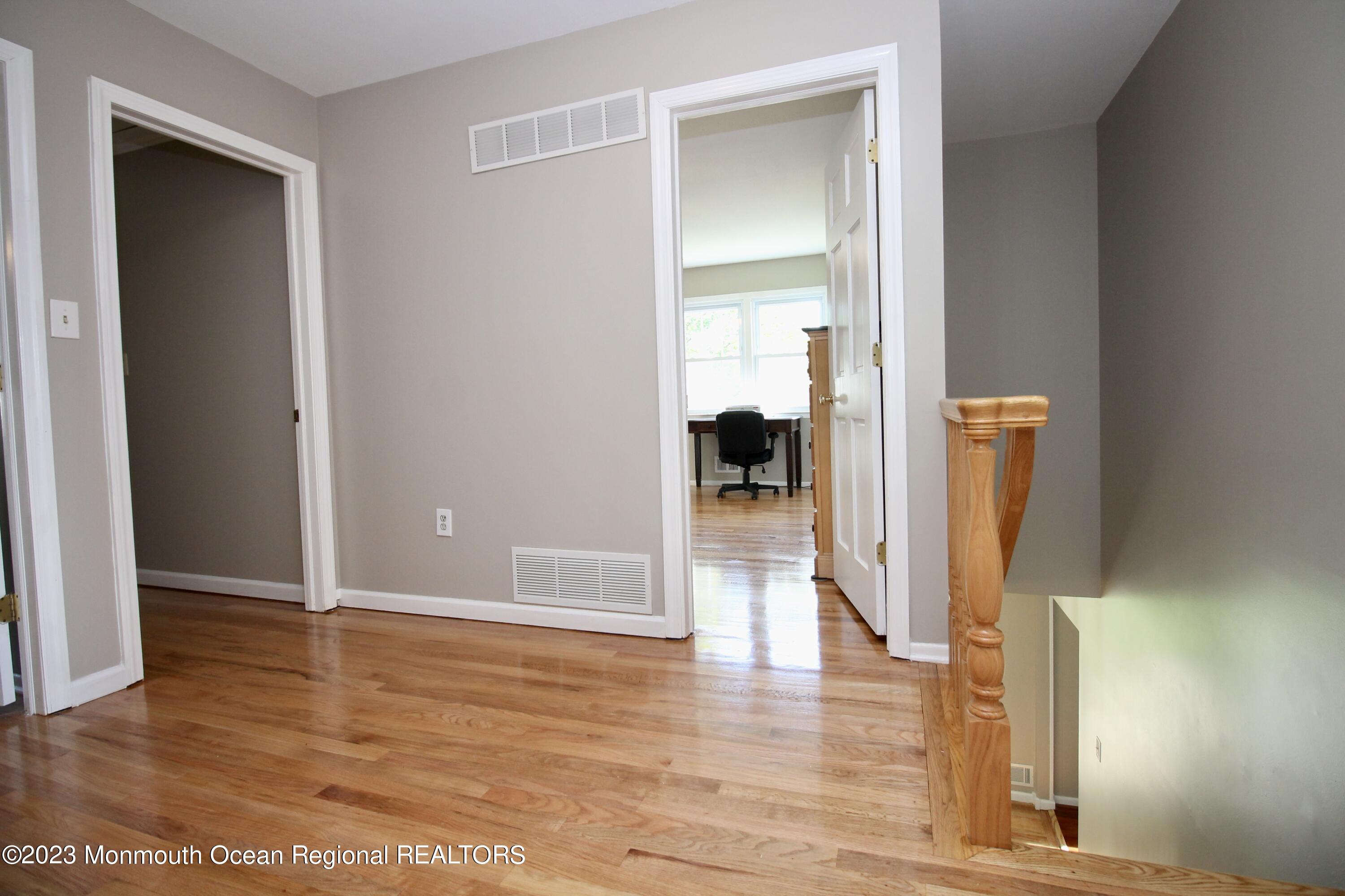 259 Kings Mountain Road Freehold, NJ 07728 - Photo 29 of 61 a view of hallway with wooden floor