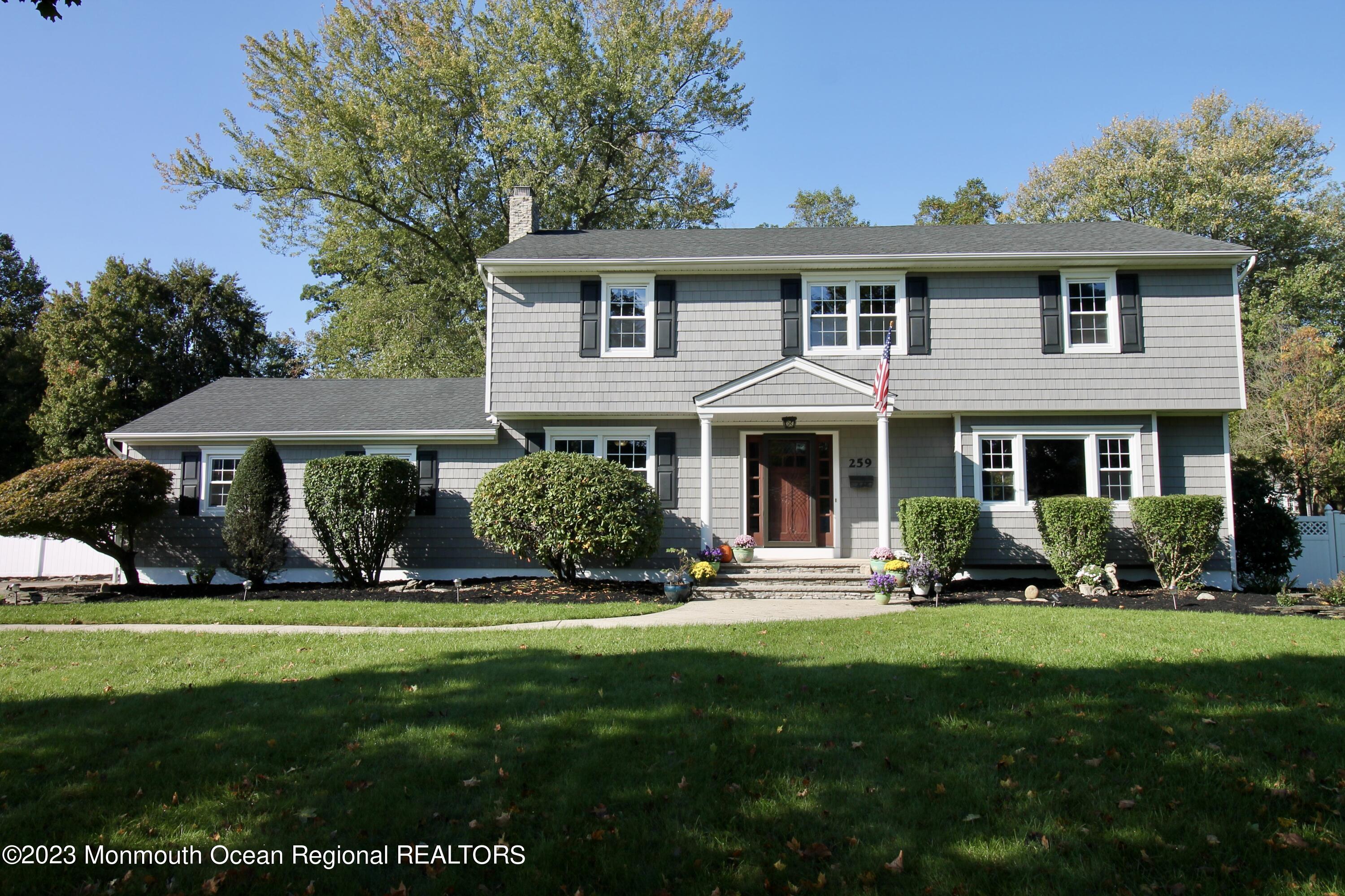259 Kings Mountain Road Freehold, NJ 07728 - Photo 4 of 61 a front view of a house with a yard table and chairs
