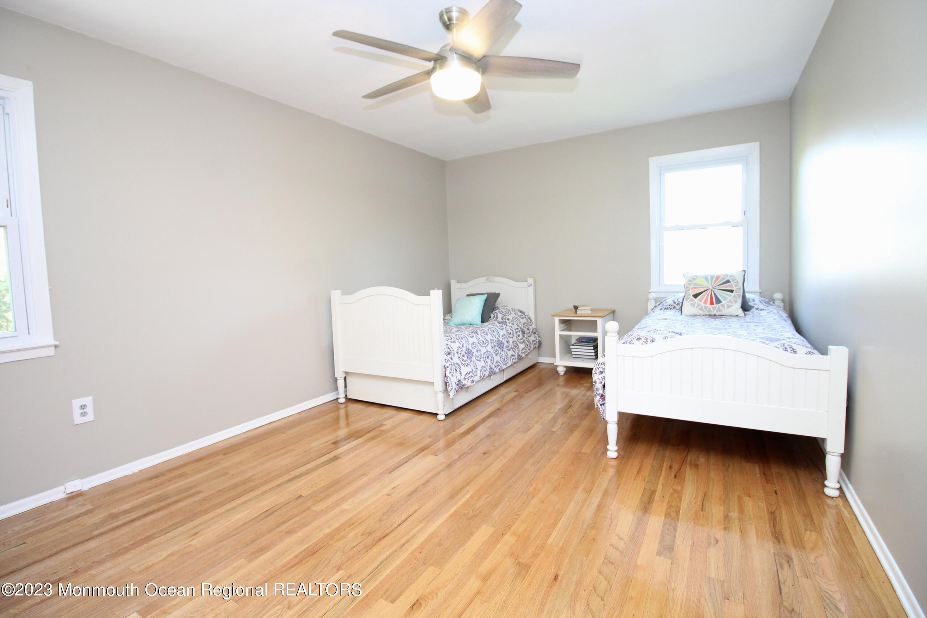 259 Kings Mountain Road Freehold, NJ 07728 - Photo 41 of 61 a living room with furniture and a wooden floor
