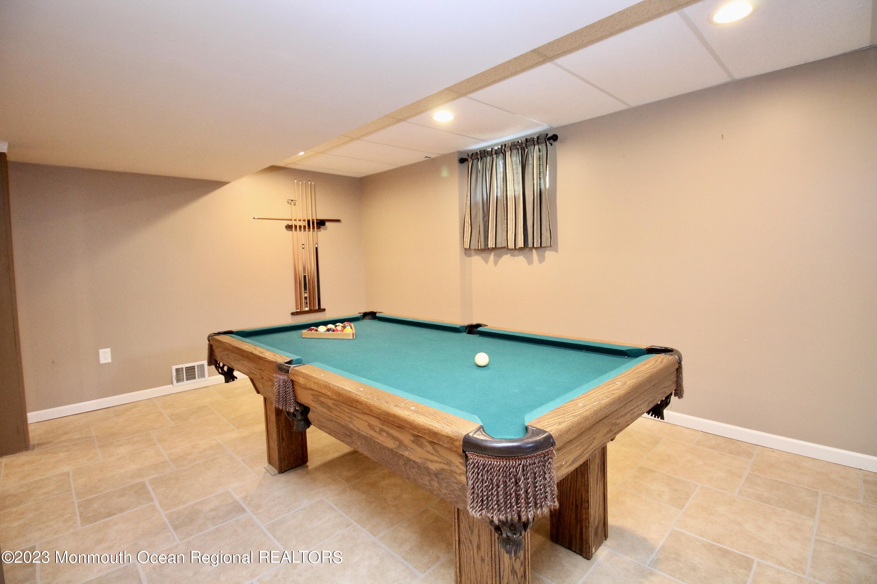 259 Kings Mountain Road Freehold, NJ 07728 - Photo 48 of 61 a room with pool table and windows