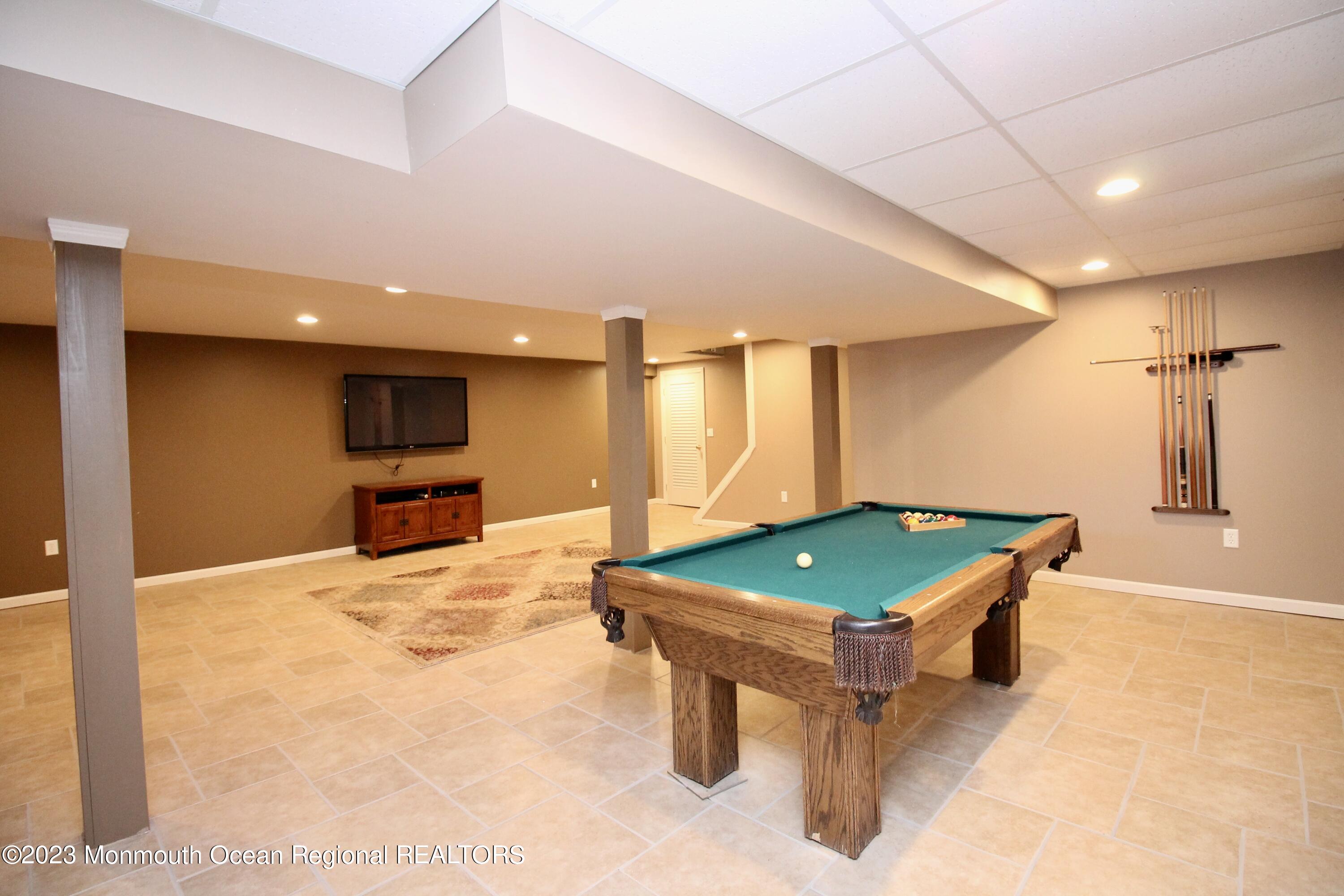 259 Kings Mountain Road Freehold, NJ 07728 - Photo 49 of 61 a room with pool table and a couch