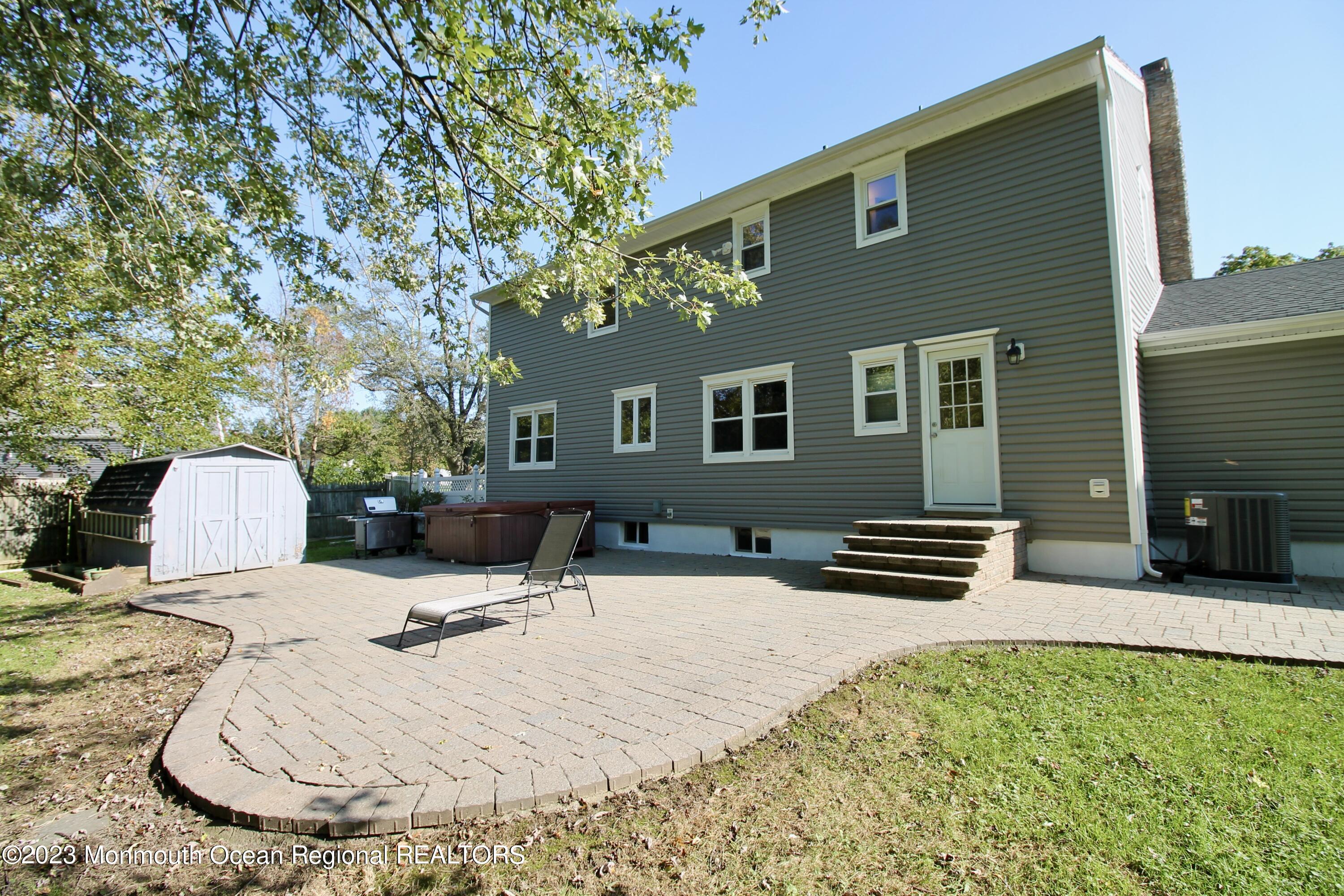 259 Kings Mountain Road Freehold, NJ 07728 - Photo 51 of 61 a backyard of a house with seating space