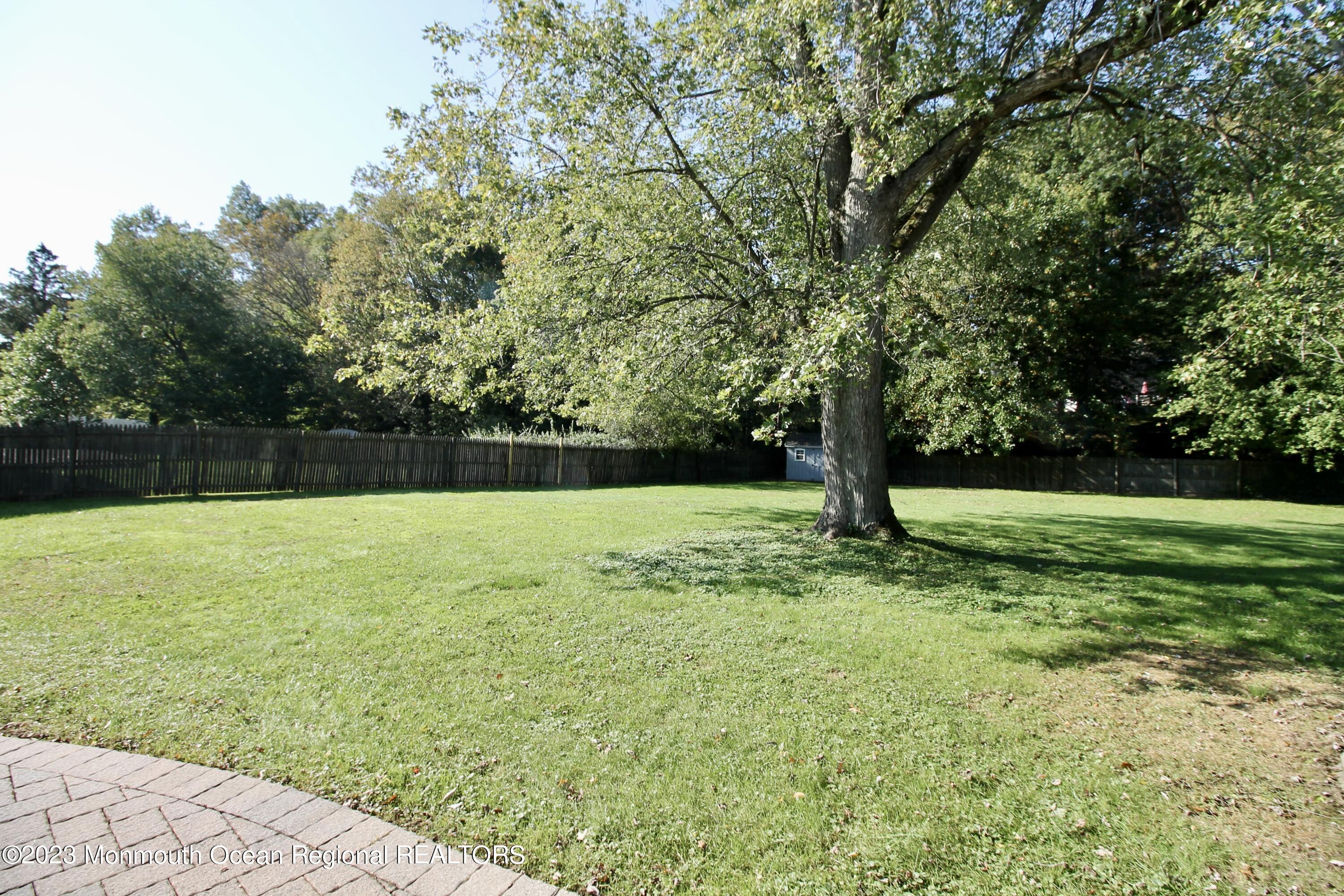 259 Kings Mountain Road Freehold, NJ 07728 - Photo 55 of 61 a view of outdoor space with deck and yard