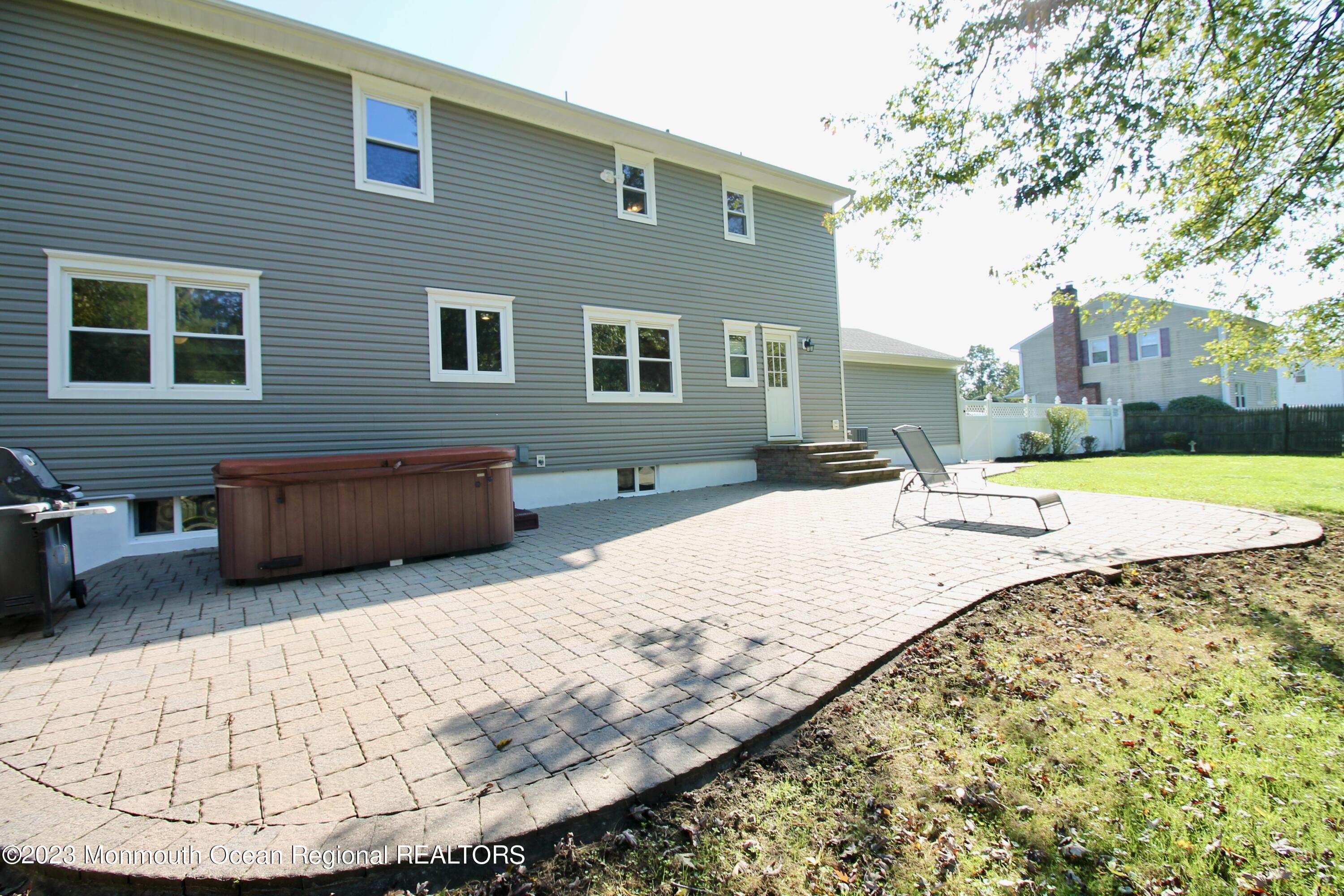 259 Kings Mountain Road Freehold, NJ 07728 - Photo 58 of 61 a view of a house with a swimming pool