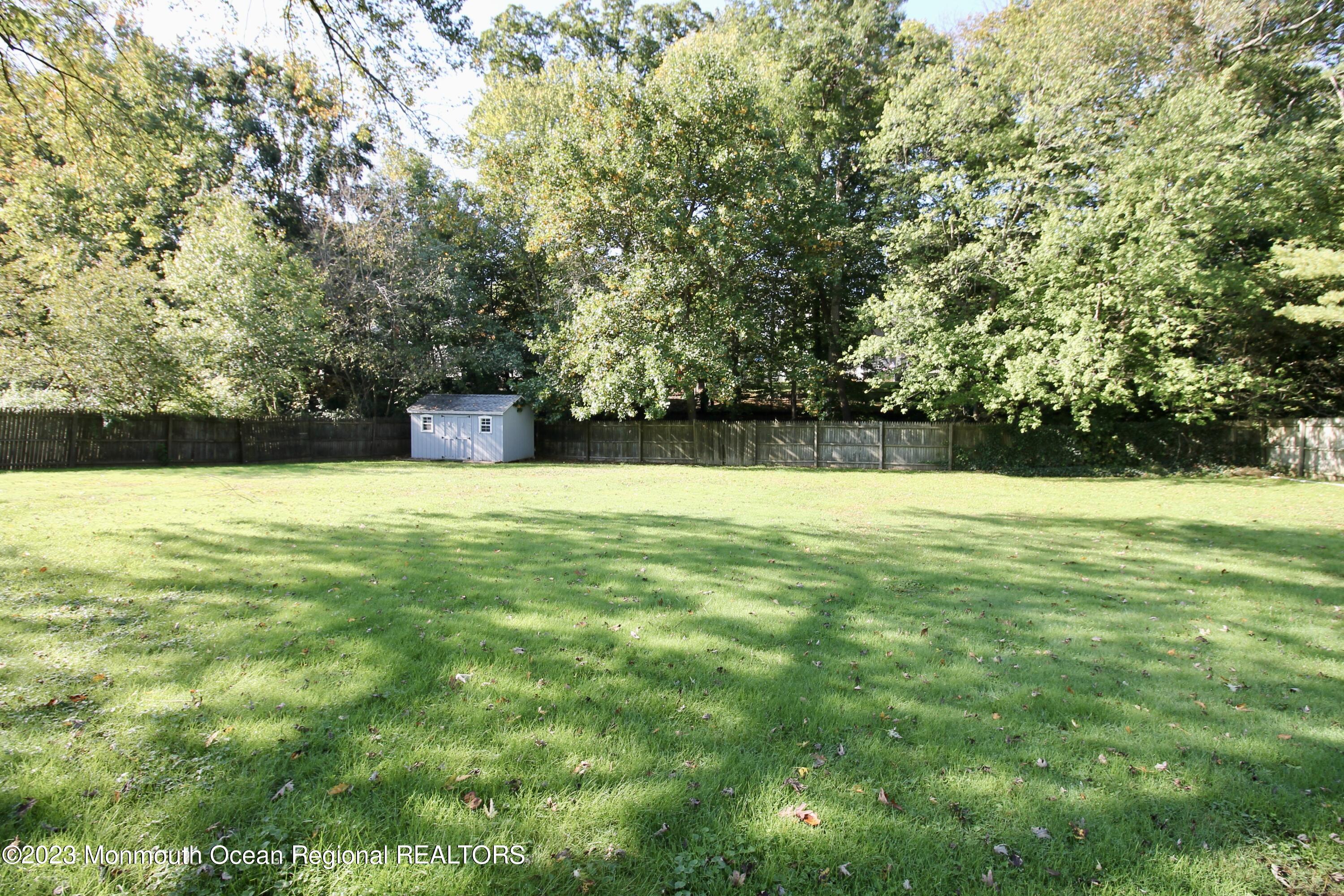 259 Kings Mountain Road Freehold, NJ 07728 - Photo 59 of 61 a view of a swimming pool with an outdoor space and seating area