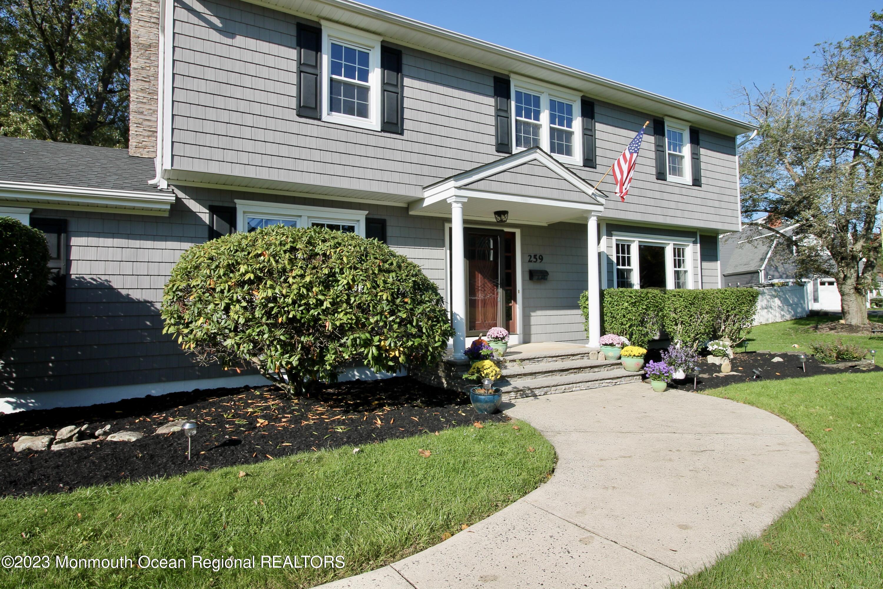259 Kings Mountain Road Freehold, NJ 07728 - Photo 6 of 61 a front view of a house with garden