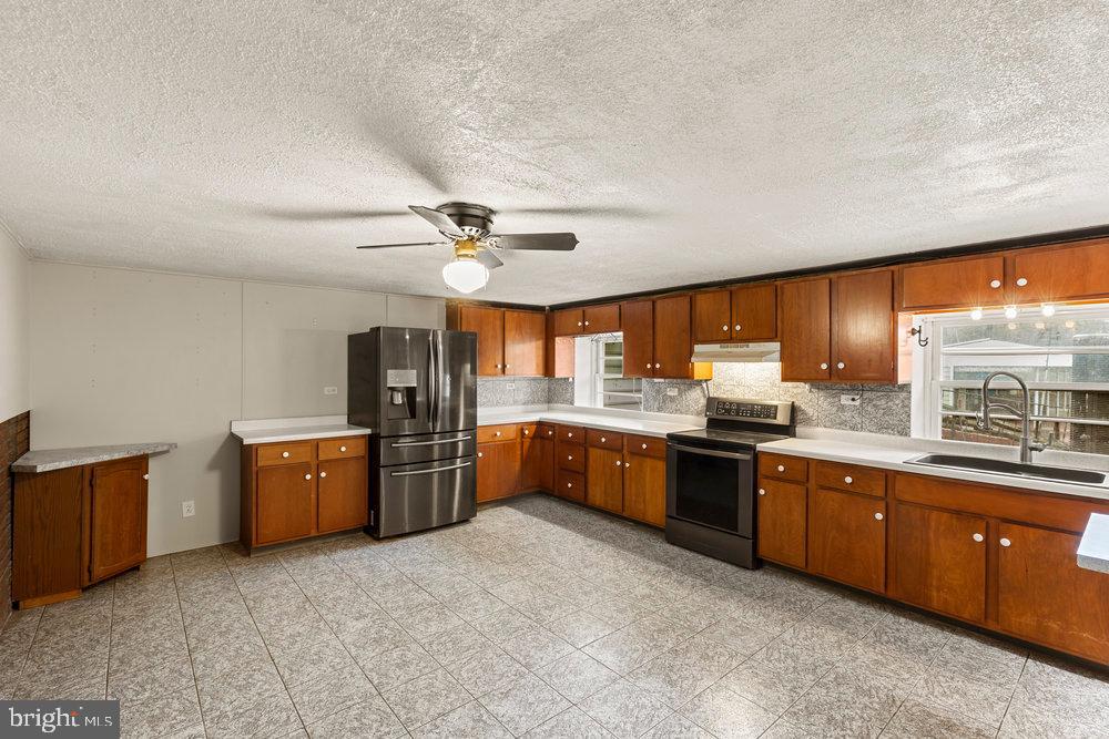 367 Bridge Valley Road Pequea, PA 17565 - Photo 11 of 51 a large kitchen with a large window and stainless steel appliances
