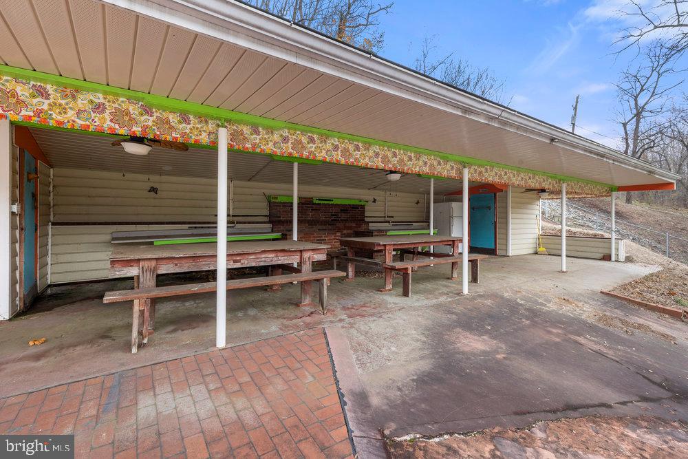 367 Bridge Valley Road Pequea, PA 17565 - Photo 43 of 51 a view of a patio with table and chairs under an umbrella