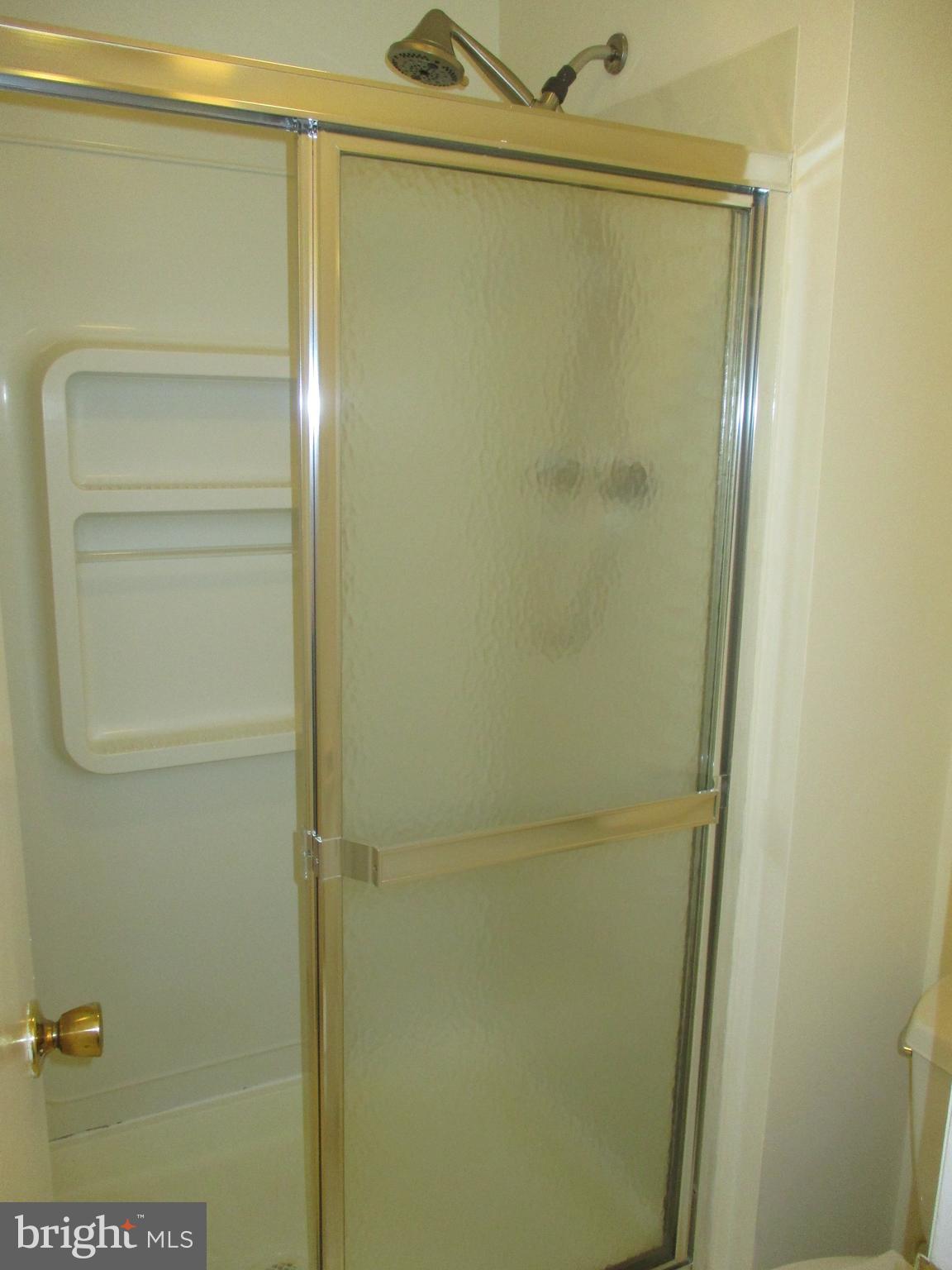 10357 Barcan Circle Columbia, MD 21044 - Photo 16 of 24 a bathroom with a glass shower door