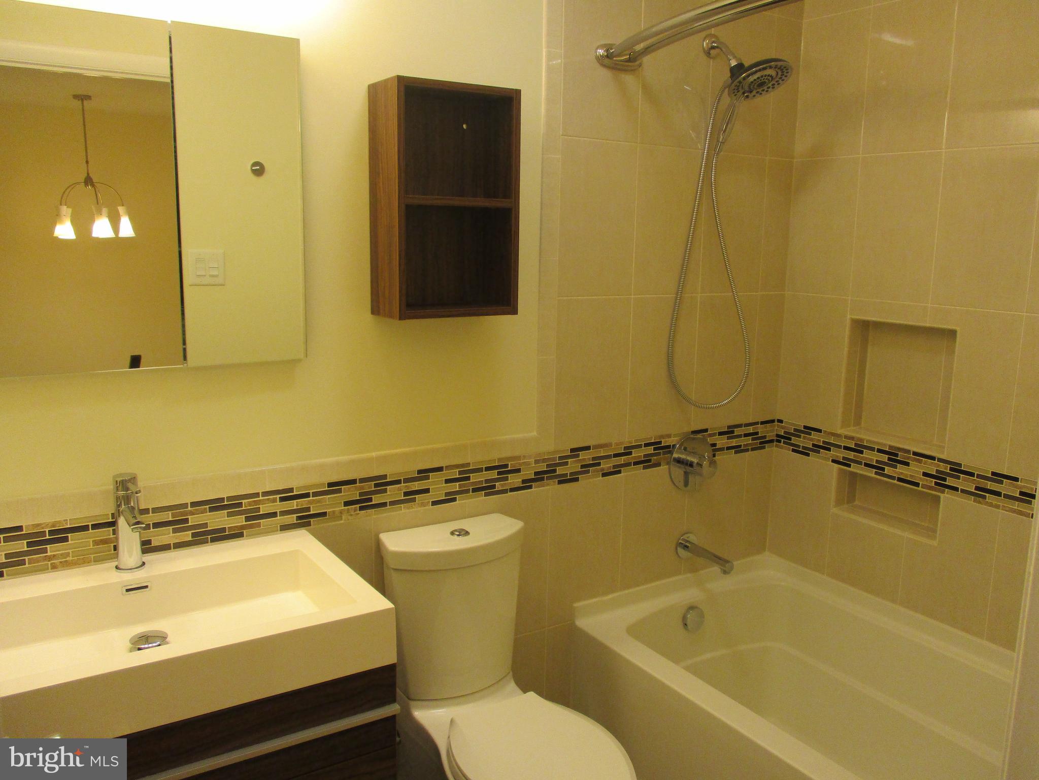 10357 Barcan Circle Columbia, MD 21044 - Photo 17 of 24 a bathroom with a sink mirror toilet and bathtub