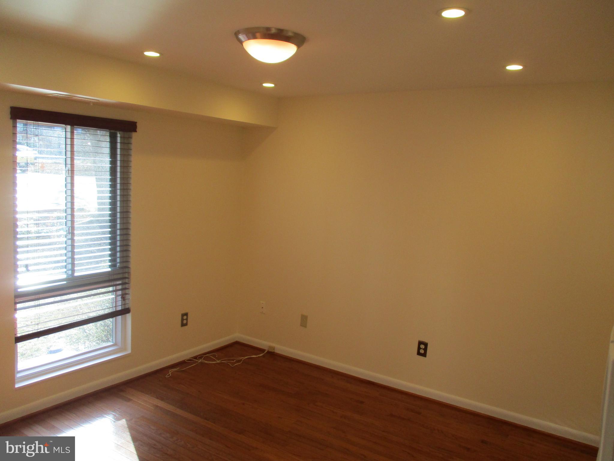 10357 Barcan Circle Columbia, MD 21044 - Photo 7 of 24 a view of a room with wooden floor and window