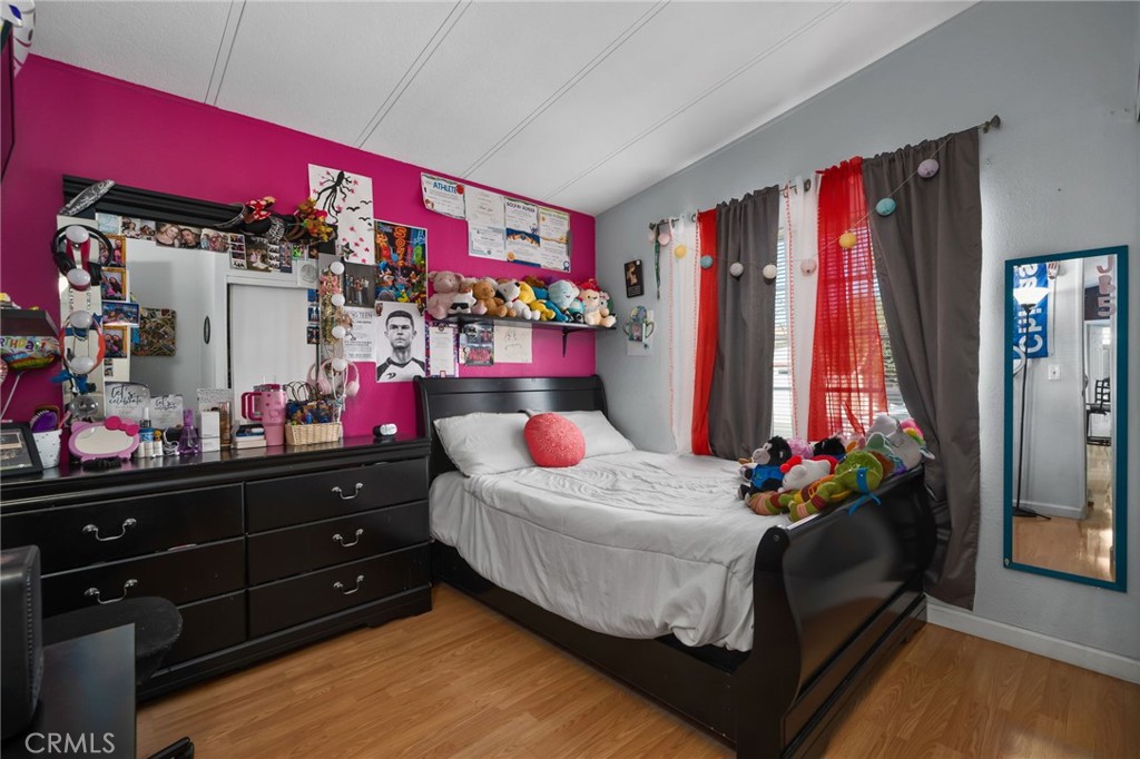 80 East Dawes, Unit 52 Perris, CA 92571 - Photo 15 of 21 a bedroom with bed and a dresser