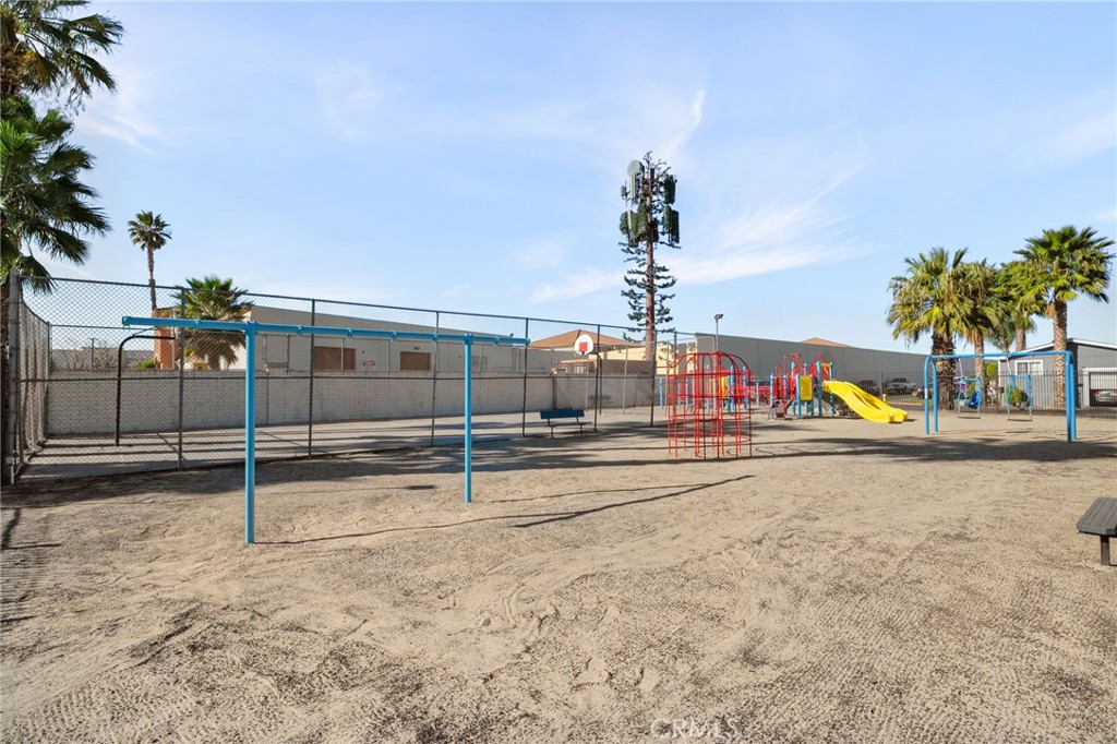 80 East Dawes, Unit 52 Perris, CA 92571 - Photo 21 of 21 a view of a swimming pool with a bench