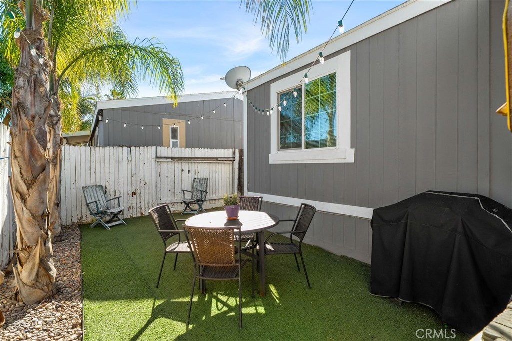 80 East Dawes, Unit 52 Perris, CA 92571 - Photo 3 of 21 a view of backyard of house with seating space