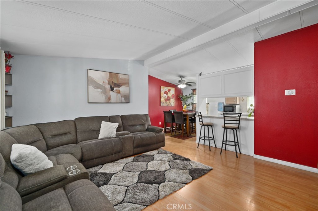 80 East Dawes, Unit 52 Perris, CA 92571 - Photo 6 of 21 a living room with furniture and kitchen view