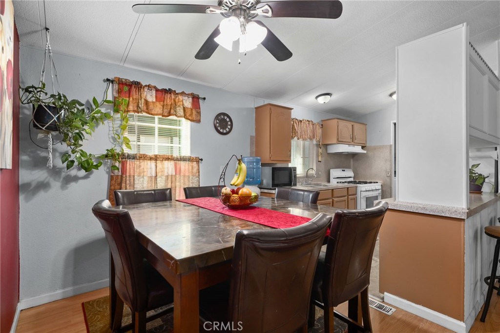80 East Dawes, Unit 52 Perris, CA 92571 - Photo 9 of 21 a dining room with furniture and window