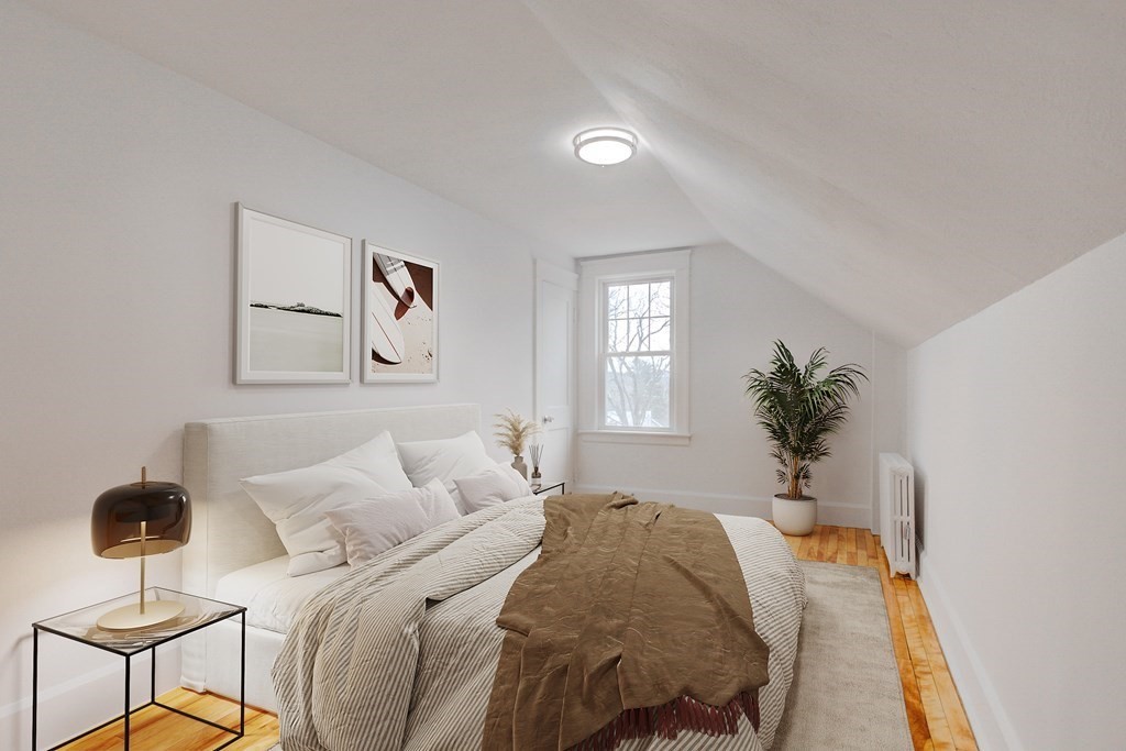 21 Alpine Trail Auburn, MA 01501 - Photo 6 of 10 a bedroom with a bed and a potted plant