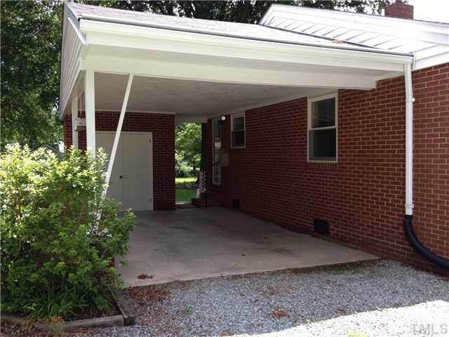 3100 Kenan Road Durham, NC 27704 - Photo 12 of 15 Carport with storage - large gravel driveway space for parking. Street parking also available
