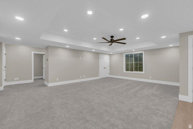2828 Jojo Road Eagle Mountain, UT 84005 - Photo 40 of 63 Spacious room featuring neutral paint, gray carpet, white trim, recessed lighting, and a ceiling fan