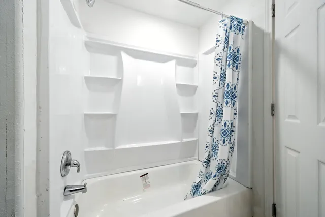 a view of house with backyard