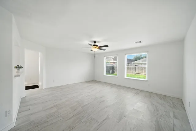 a view of an empty room with a window