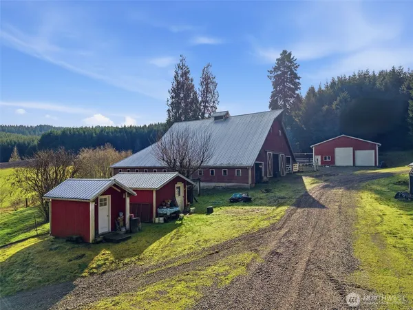 a aerial view of a house with swimming pool in front of the house