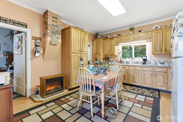 a kitchen with stainless steel appliances granite countertop a stove a sink dishwasher and cabinets with wooden floor