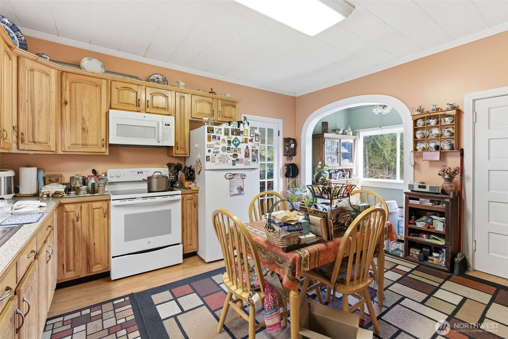211 Echo Road Rochester, WA 98579 - Photo 32 of 39 a kitchen with stainless steel appliances granite countertop a stove a sink dishwasher and cabinets with wooden floor