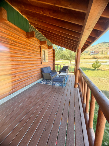 358 Maple Drive Fish Haven, ID 83287 - Photo 31 of 49 Spacious covered porch with wood-finish decking and wood railing