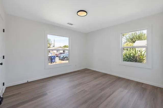 an empty room with windows and window