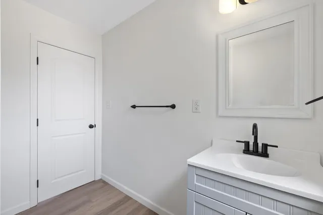 a bathroom with a sink and a mirror