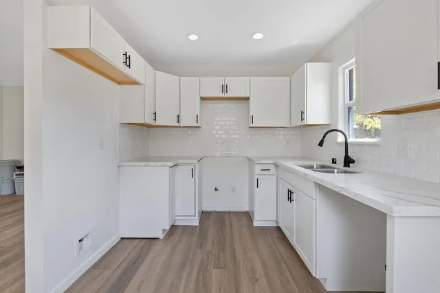 a kitchen with cabinets a sink and dishwasher