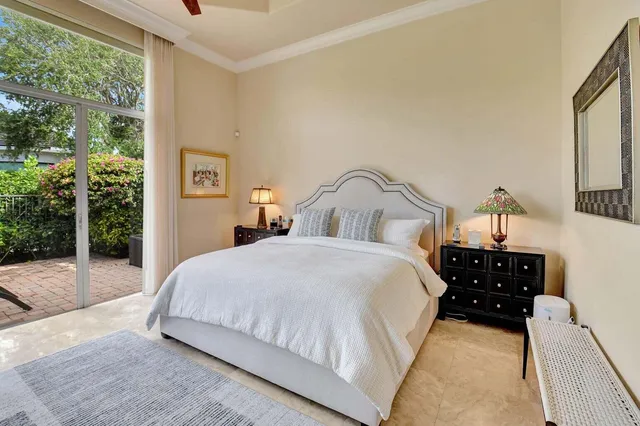 a bathroom with a granite countertop tub sink and mirror