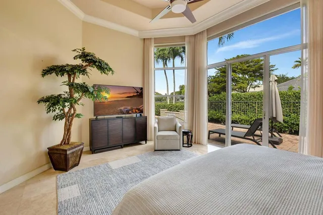 a bedroom with a bed and a mirror