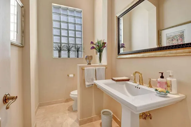 a view of a patio with table and chairs potted plants and large tree