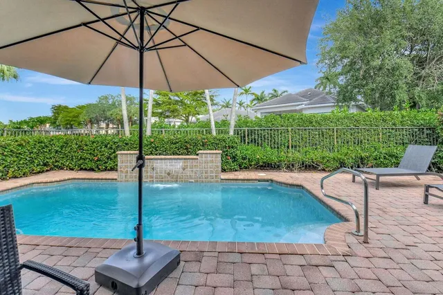 a view of a patio with couches and dining table and chairs with wooden floor