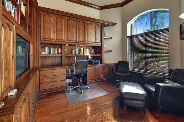 a living room with furniture and a mirror