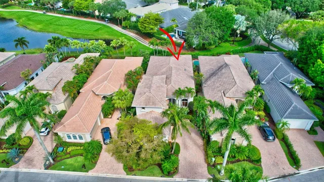 an aerial view of residential house with outdoor space and swimming pool