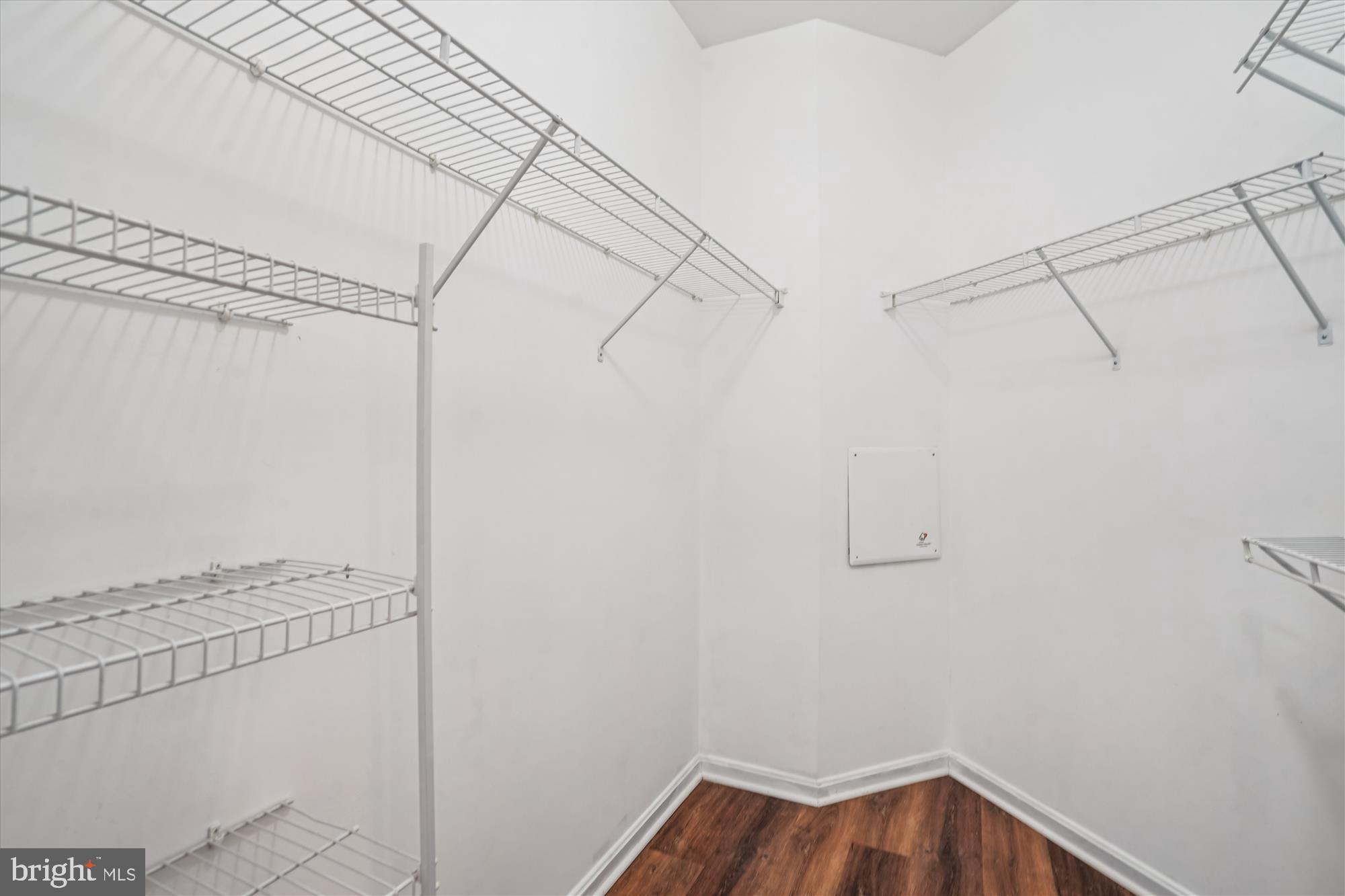 9490 Virginia Center Boulevard, Unit 130 Vienna, VA 22181 - Photo 15 of 57 a view of a room with racks on the wall