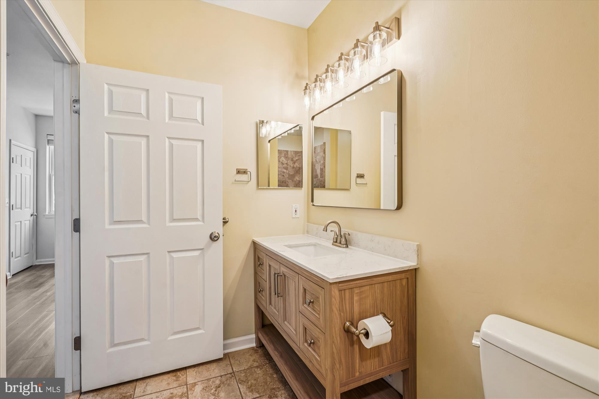 9490 Virginia Center Boulevard, Unit 130 Vienna, VA 22181 - Photo 17 of 57 a bathroom with 2 sink and a mirror