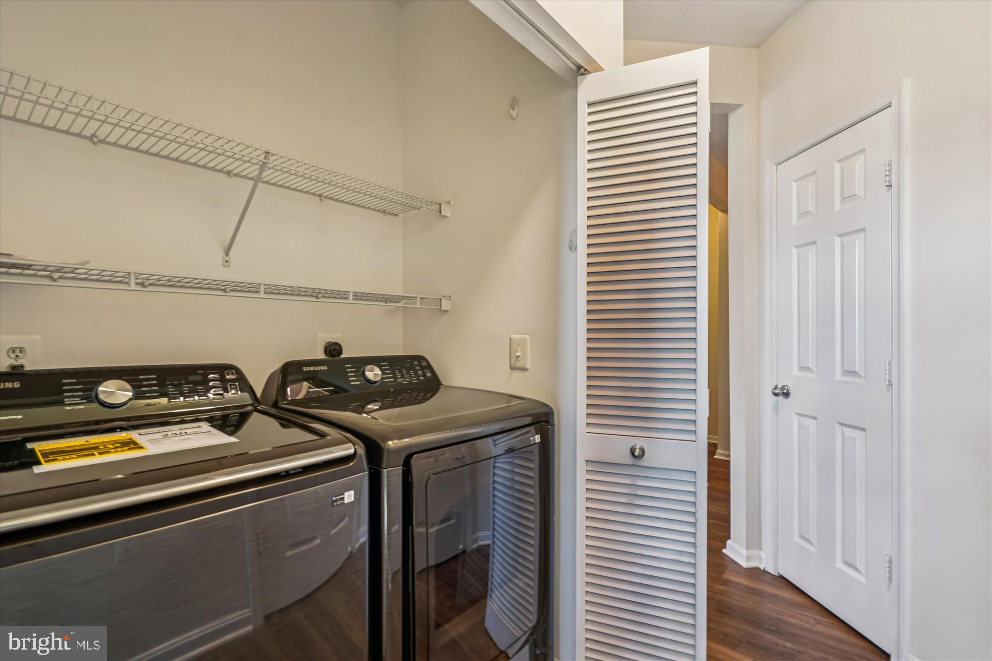 9490 Virginia Center Boulevard, Unit 130 Vienna, VA 22181 - Photo 23 of 57 Hall with brand new washer and dryer